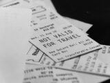Pile of receipts, one says not valid for travel