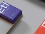 a purple box sitting on top of a table next to a red box