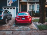 parked red Lexus RC 300 in front of house
