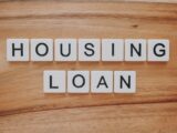 housing loan blocks on brown wooden surface