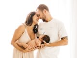 man in white crew neck t-shirt kissing woman in white dress