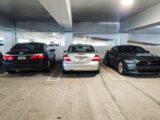 A group of cars parked in a parking garage