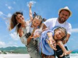A happy family enjoying a sunny day at the beach.