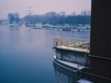 brown wooden dock on lake during daytime