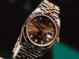 silver and gold round analog watch at 10 10
