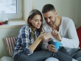 Couple looking at a smartphone together