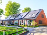 A house with a lot of solar panels on the roof
