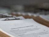 restaurant menus on clipboards close up