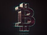 A shiny bitcoin logo on a black background
