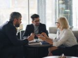 a group of people sitting around a table