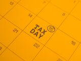 Calendar shows "tax day" circled on the 15th.