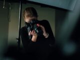 woman taking photo