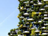 a very tall building with lots of plants growing on it