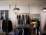 clothing boutique interior with hanging racks
