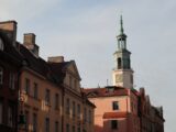 a tall building with a clock on the top of it