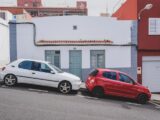 white and red 5-door hatchbacks on street