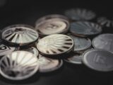 a pile of coins sitting on top of a table