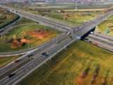 Aerial view of a highway interchange with cars
