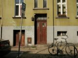 a bicycle parked on the side of a street